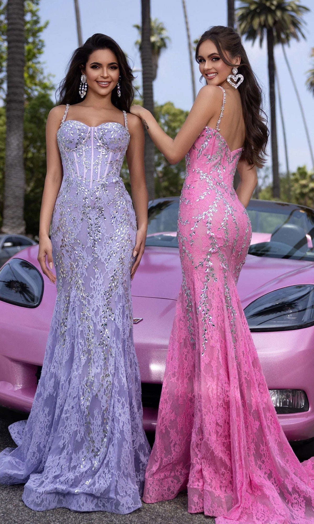 Two women stand before a pink convertible and palm trees, one wearing the Portia and Scarlett PS25150 long prom dress in lilac/silver with embellishments and a corset bodice.